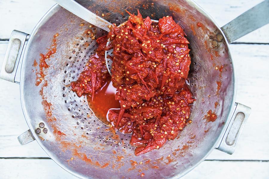 Making Tomato Sauce Photograph by Nika Moskalenko