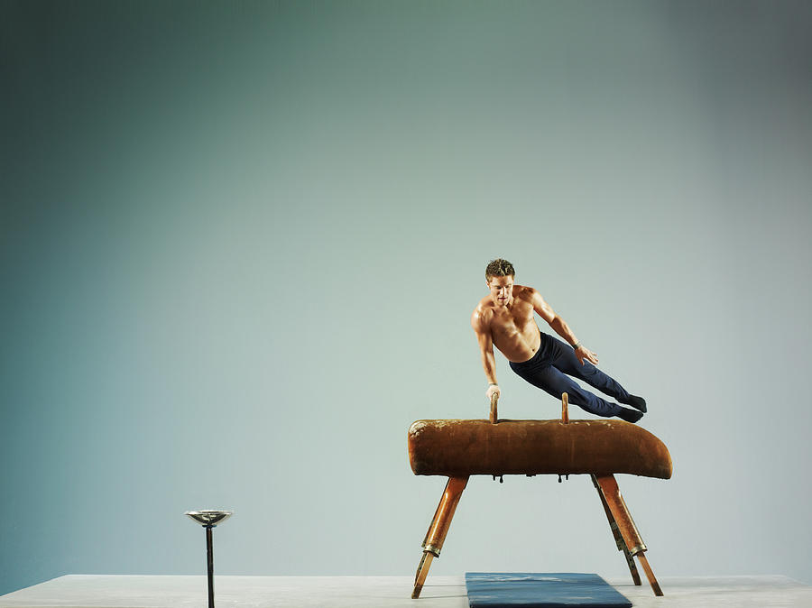 Caucasian Ethnicity Photograph - Male Athlete Using A Pommel Horse by 10000 Hours