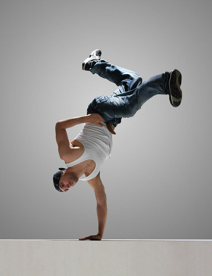 Male Breakdancer Balancing On One Hand Photograph by John Lamb