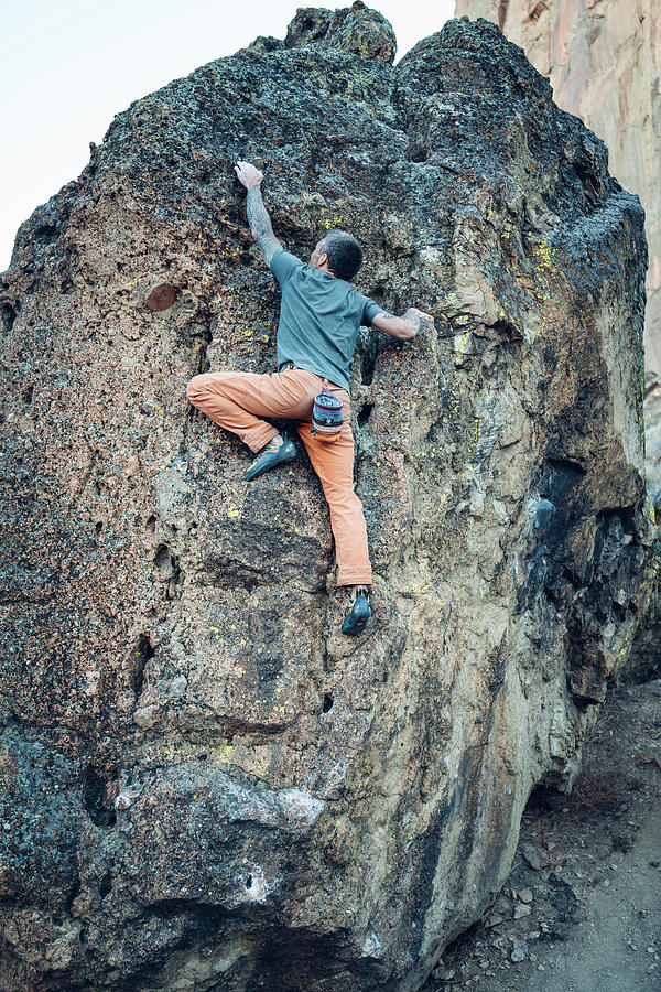 Sports Photograph - Male Climber Is Reaching The Next Hold On The Boulder In Smith Rock by Cavan Images