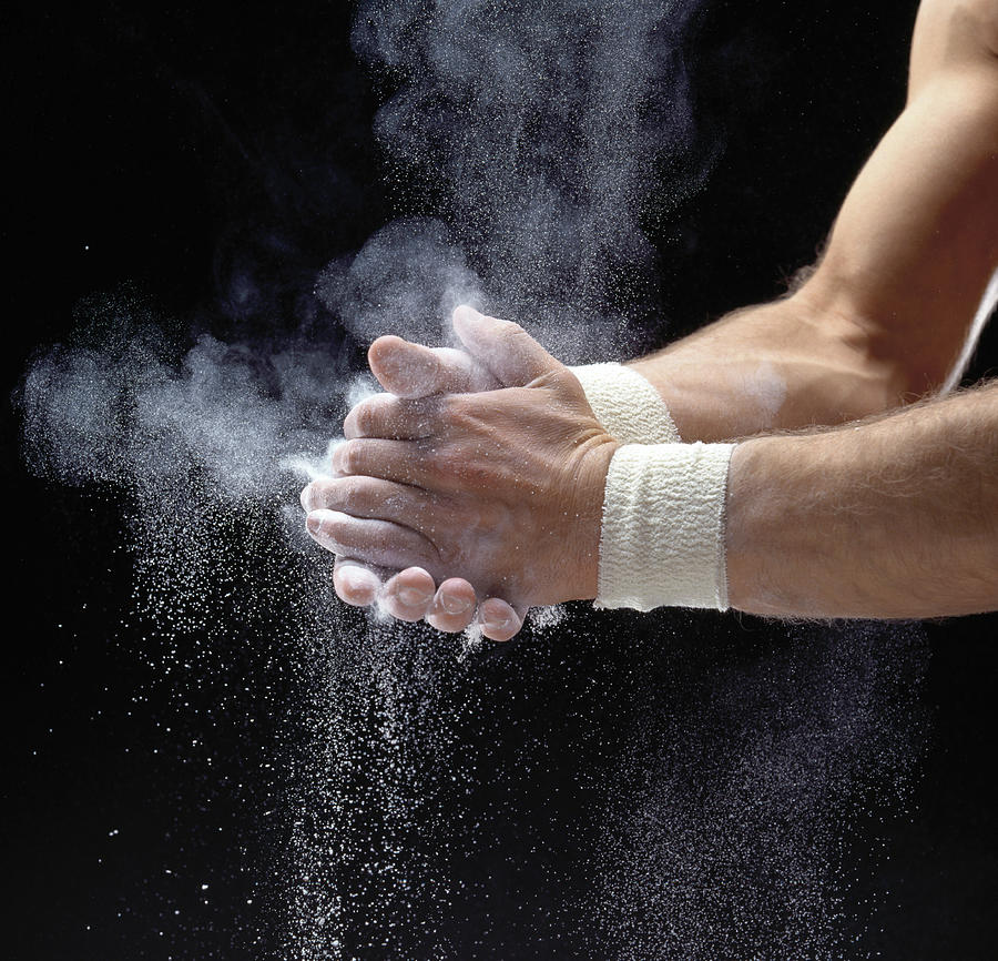 Male Gymnast Powdering Hands, Close-up Photograph by Ray Massey