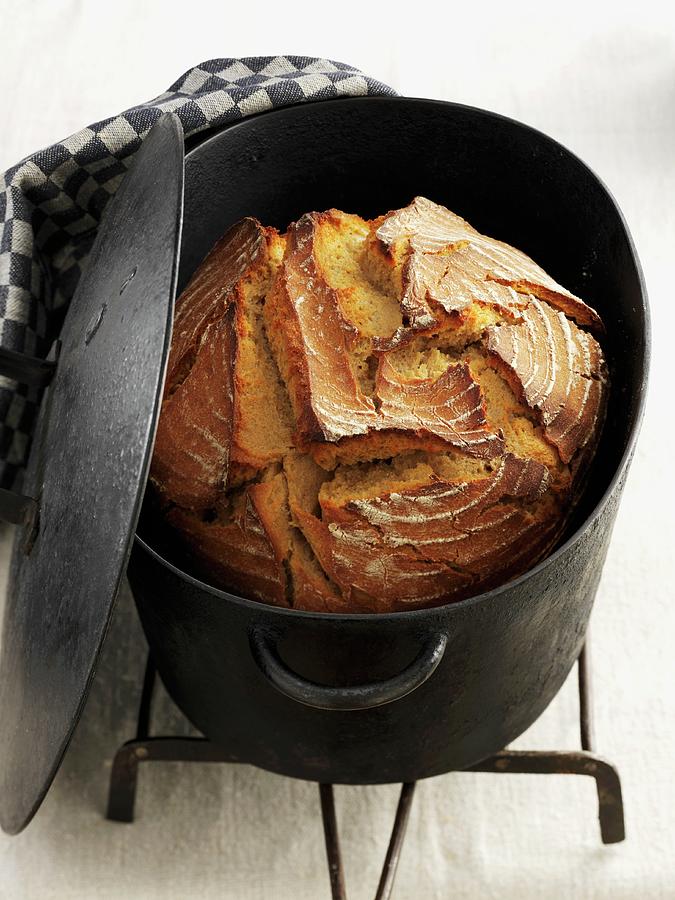 Malt Bread In A Cast Iron Pot Photograph by Newedel, Karl