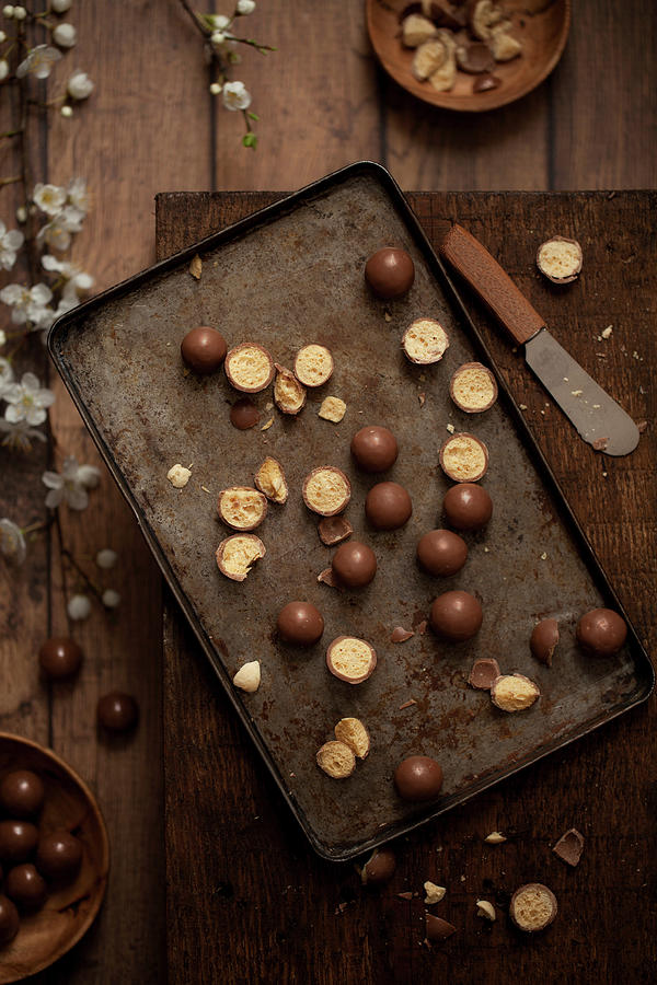 Malted Chocolate Balls Maltesers On A Vintage Baking Tray Photograph by Jane Saunders