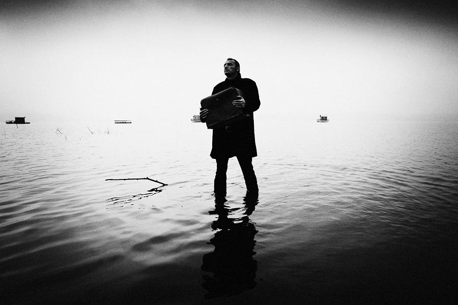 Man Photograph - Man And Lake by Amir Bajrich