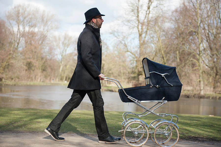 Man And Vintage Pram Photograph by Lucy Lambriex