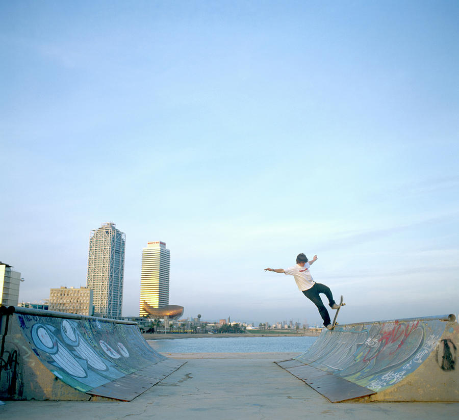 Man Balancing Skateboard On Ramp Photograph by Paul Calver