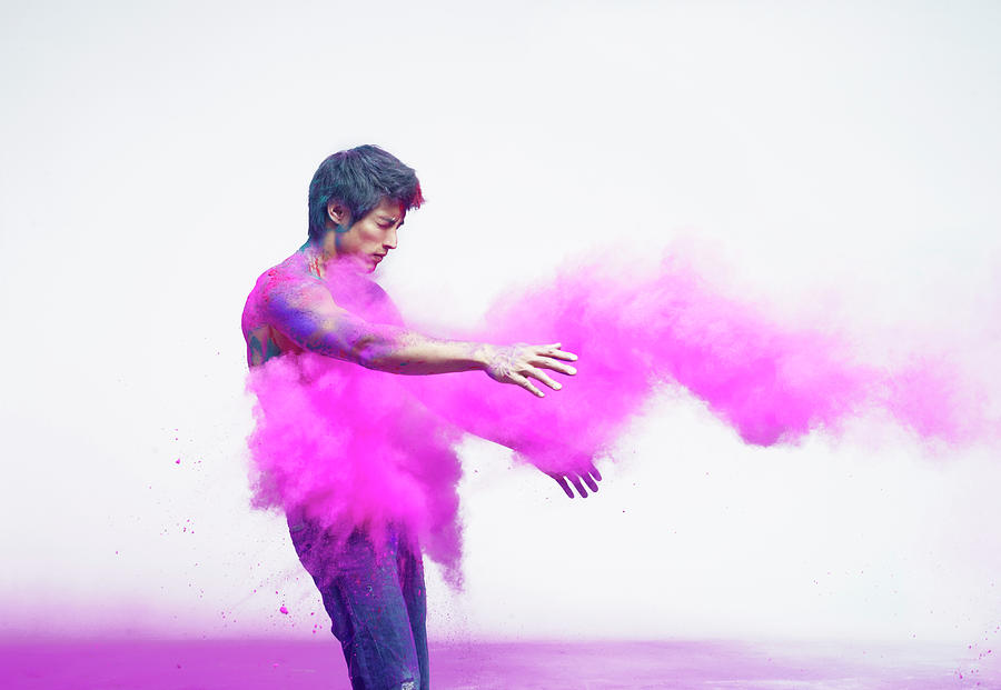 Spray Photograph - Man Being Impacted By Bright Pink by Tara Moore