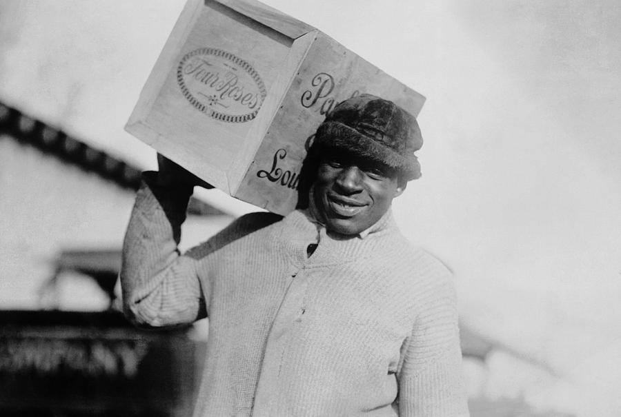 Man Carrying A Case Whiskey - Prohibition Era Photograph by War Is Hell Store