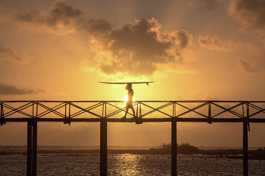 Paradise Photograph - Man Carrying Surfboard On Bridge Of Cloud 9 Siargao Philippines by Cavan Images