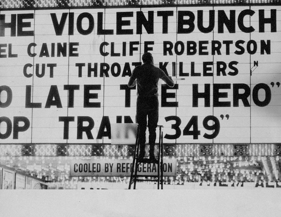 Man Changes Letters On Movie Marquee At Photograph by New York Daily News Archive