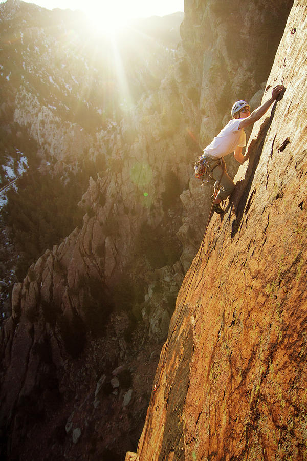 Man Climbing Mountain On Sunny Day Photograph by Cavan Images | Fine ...