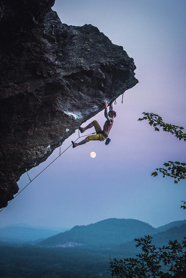 Sunset Photograph - Man Climbing Overhanging Sport Climbing Route In New Hampshire by Cavan Images