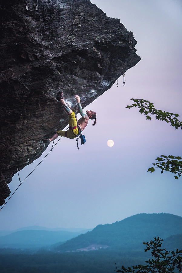 Sunset Photograph - Man Climbing Overhanging Sport Climbing Route With Moon. by Cavan Images