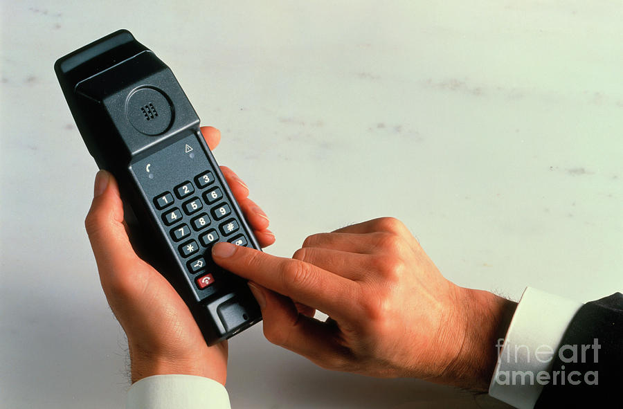 Man Dialling A Number Into A Cellular Phone Photograph by Rosenfeld Images Ltd/science Photo Library