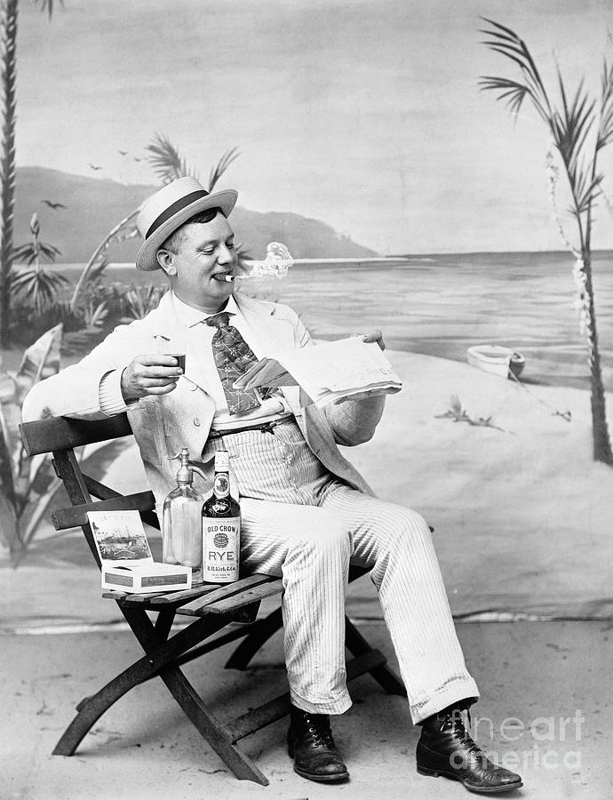 Man Drinking And Smoking Photograph by Bettmann
