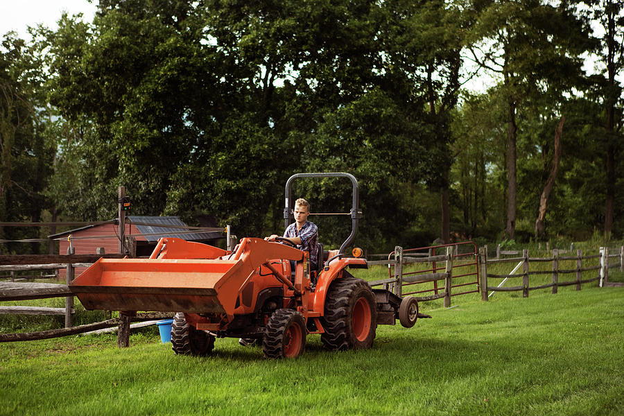 Man Driving Tractor In Farm Photograph by Cavan Images - Fine Art America