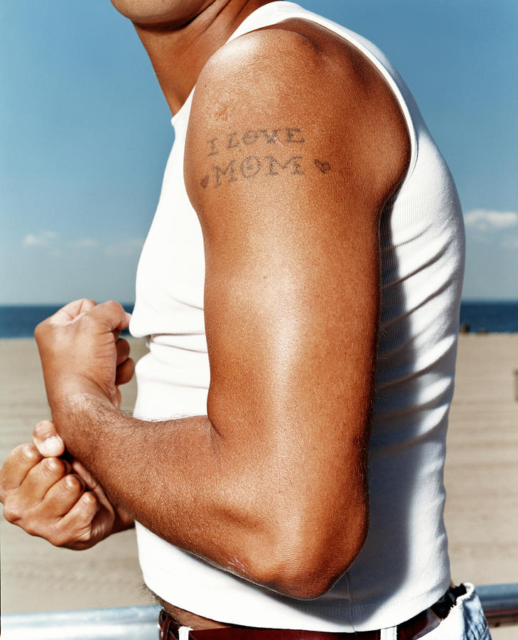Man Flexing Arm With Tattoo Reading Photograph by Erin Patrice Obrien Man Flexing Arm With Tattoo Reading Photograph by Erin Patrice Obrien