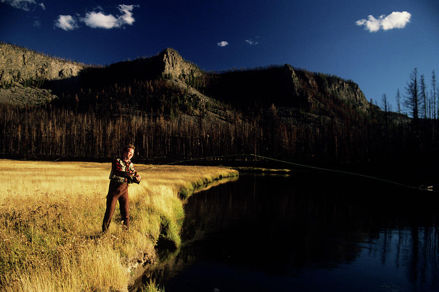 Man Fly Fishing In Madison River Photograph by Karl Weatherly