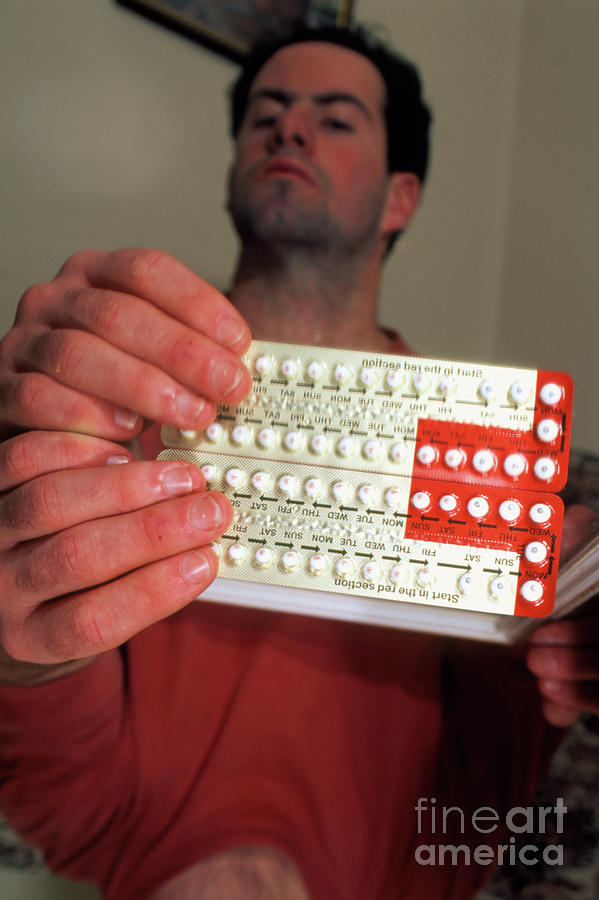 Man Holding A Packet Of Female Contraceptive Pills Photograph by Conor Caffrey/science Photo Library