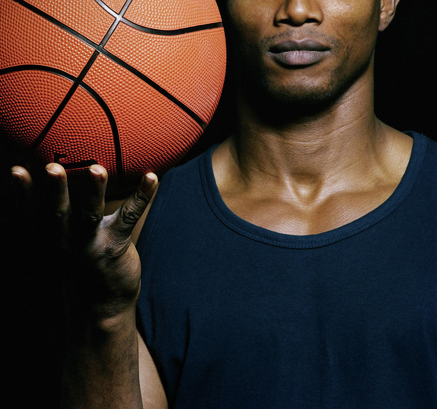 Man Holding Basketball, Close-up Photograph by John Lamb