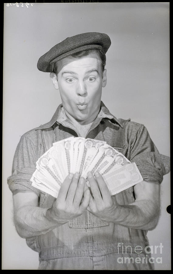 Man Holding Fan Of Money Photograph by Bettmann