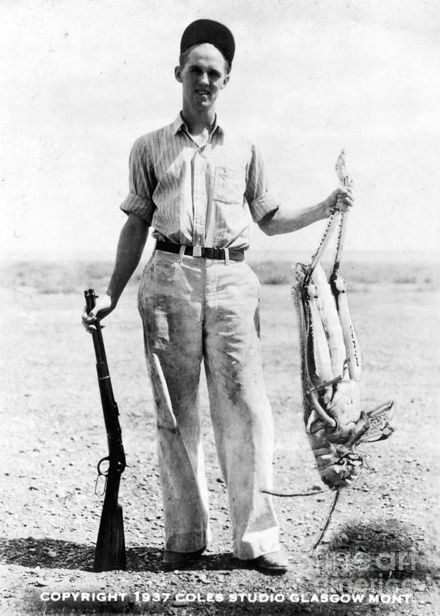 Man Holding Giant Grasshopper Photograph by Bettmann