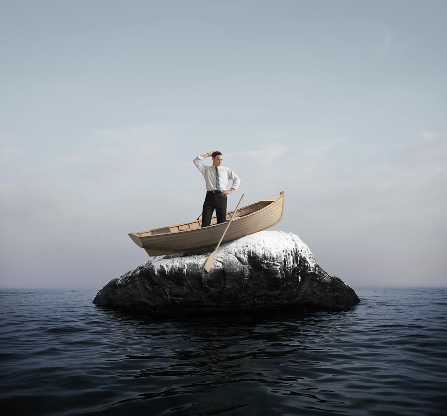 Man In Boat Stuck On A Rock Photograph by Stephen Swintek