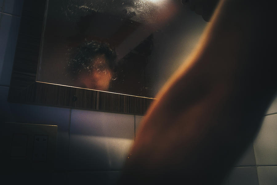 Space Photograph - Man In Front Of The Mirror After A Bath by Cavan Images