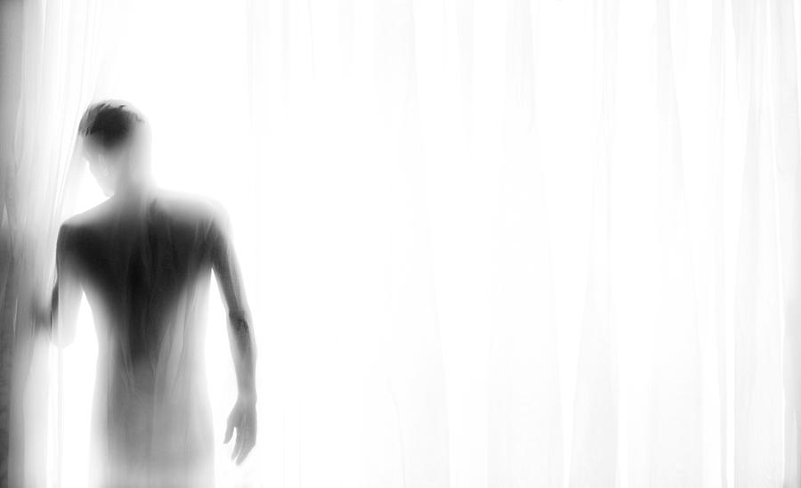 Black And White Photograph - Man In Light by Babak Haghi