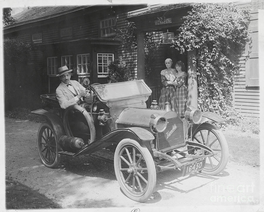 Man In Old-fashioned Car Photograph by Bettmann