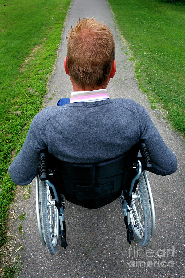 Man In Wheelchair In Park Photograph by Medicimage / Science Photo Library