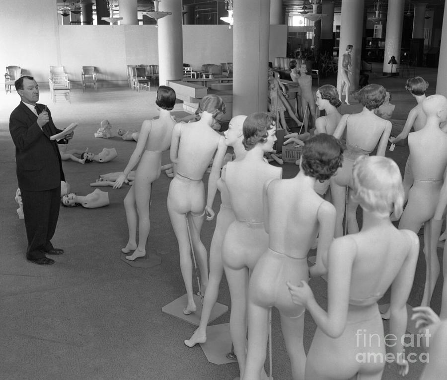 Man Inspecting Mannequins Photograph by Bettmann