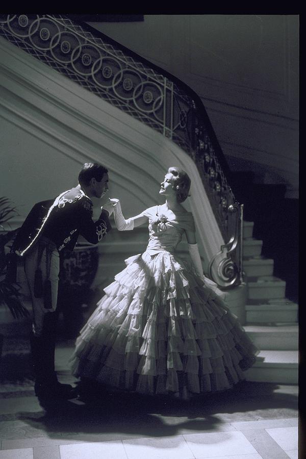 Man Kisses Hand Of Woman In Ball Gown Photograph by Archive Holdings Inc. Man Kisses Hand Of Woman In Ball Gown Photograph by Archive Holdings Inc.