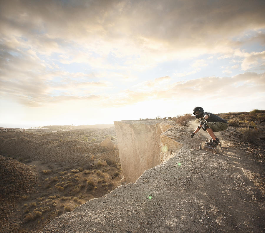 Man Landboarding On Rocks Photograph by Stanislaw Pytel