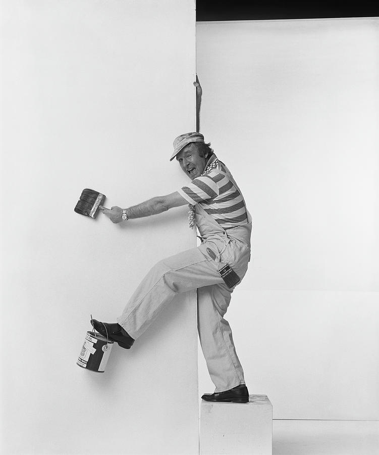 Man Leaning On Wall Holding Paint Photograph by Tom Kelley Archive Man Leaning On Wall Holding Paint Photograph by Tom Kelley Archive