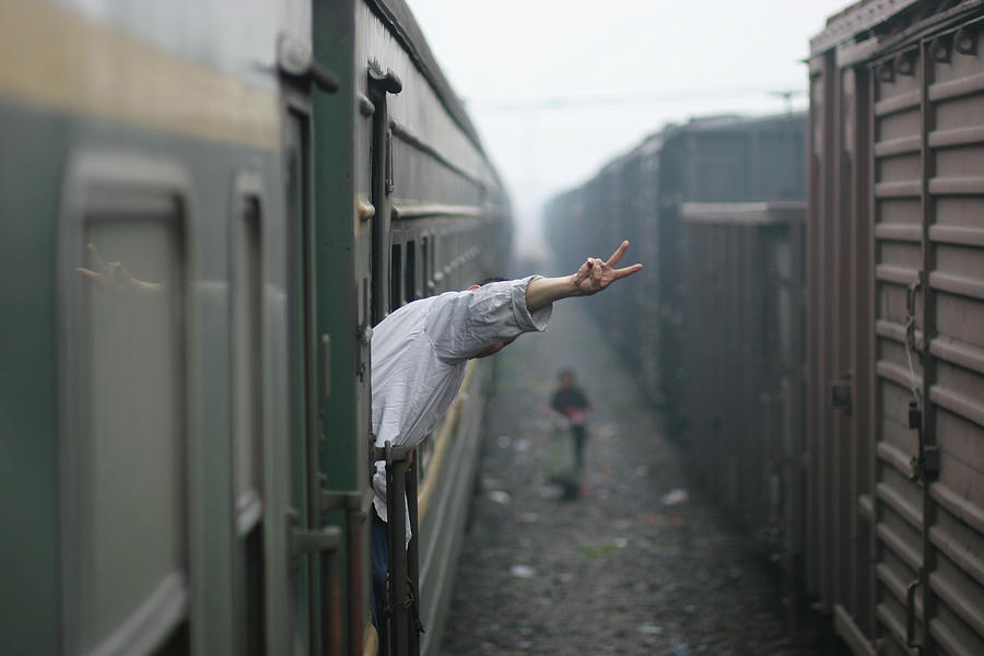 Man Leaning Out Of Train Window by Verbiphotography.com