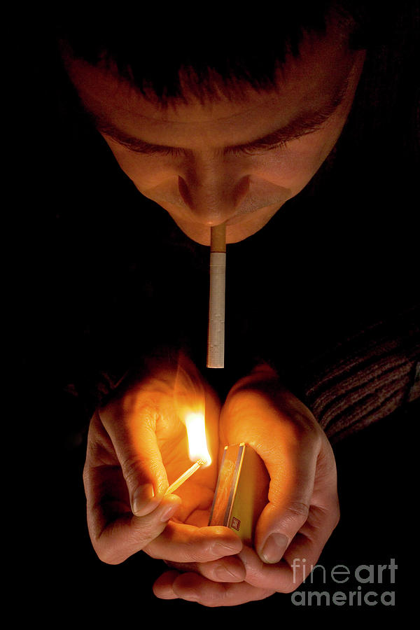 Man Lighting A Cigarette Photograph by Daniel Sambraus, Thomas