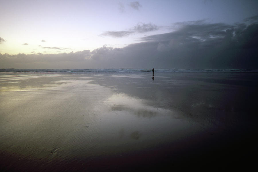 Man on beach Photograph by Nicholas Henfrey