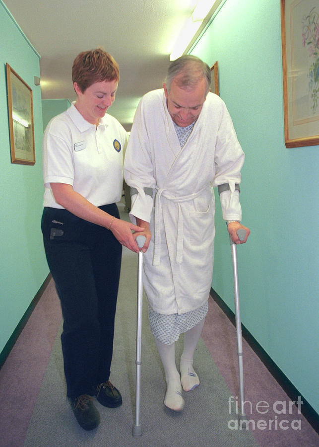 Man On Crutches Photograph by Samuel Ashfield/science Photo Library