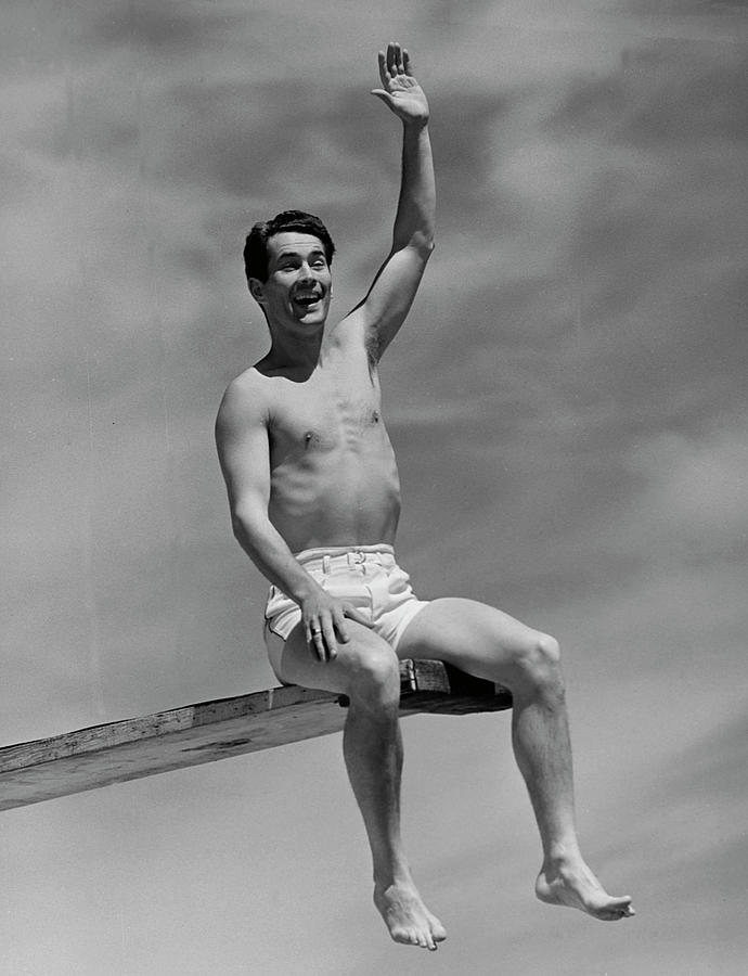 Man On Diving Board Photograph by George Marks