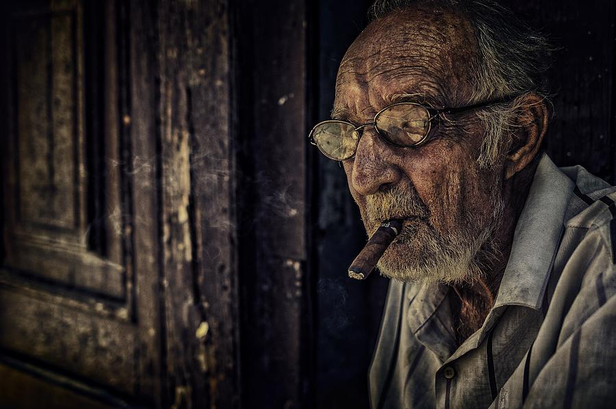Man On Porch Photograph by Pavol Stranak