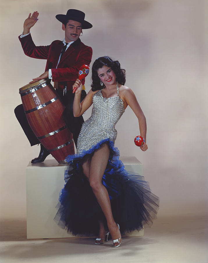 Man Playing Drum, Woman Holding Maraca Photograph by Tom Kelley Archive