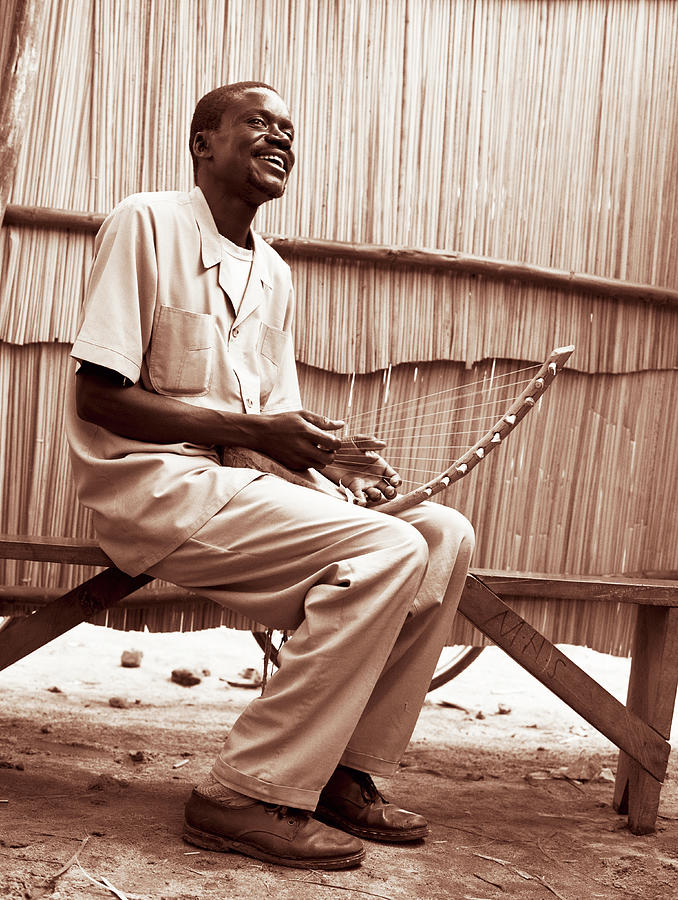 Man Playing Harp, Smiling Sepia Tone Photograph by David Sacks