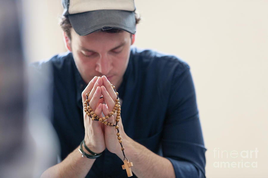 Man Praying With Rosary Photograph by Caia Image/science Photo Library