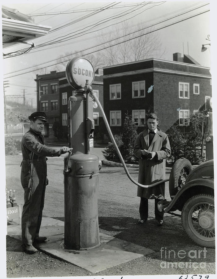 Man Pumping Gas Photograph by Bettmann