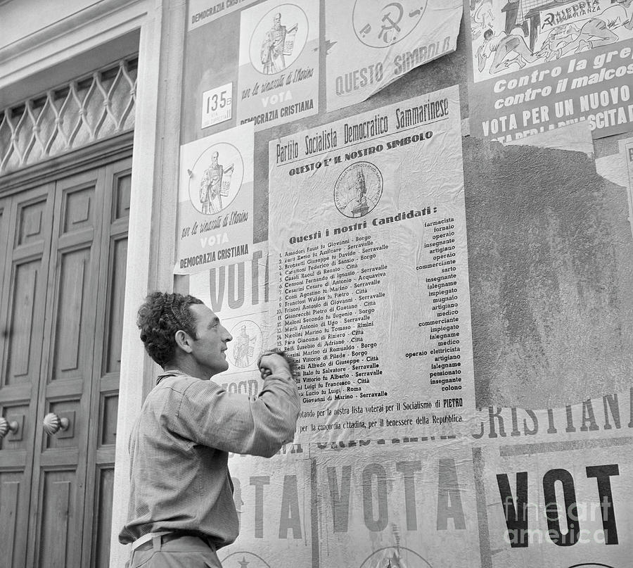 Man Putting Up Political Posters In San Photograph by Bettmann