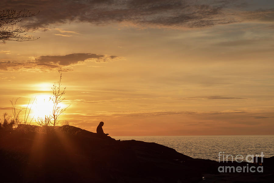 Sunset Photograph - Man Reading A Book By A Lake At Sunset by Jim West/science Photo Library