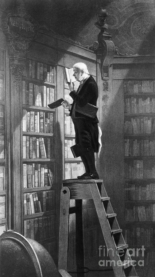 Man Reading On Ladder In Library Photograph by Bettmann