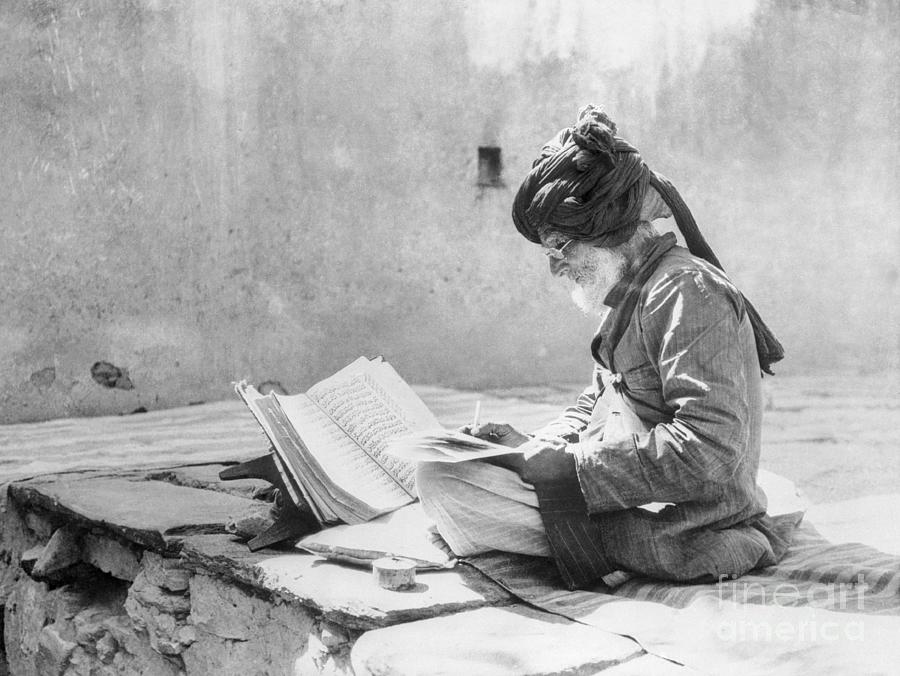 Man Reading The Koran Photograph by Bettmann