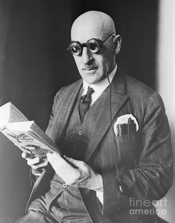 Man Reading With Lighted Eyeglasses Photograph by Bettmann